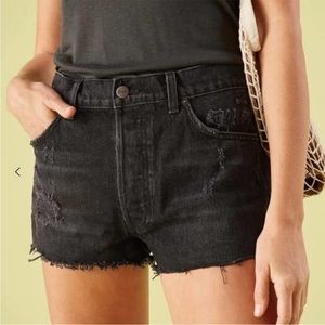 Reformation distressed black denim shorts.